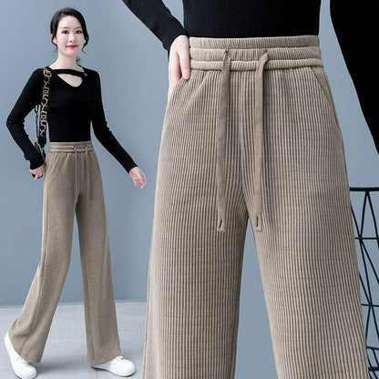 🔥【Compre uno y llévese otro gratis】 👖Nuevos pantalones casuales de terciopelo con perneras anchas, muy cómodos de usar.-E